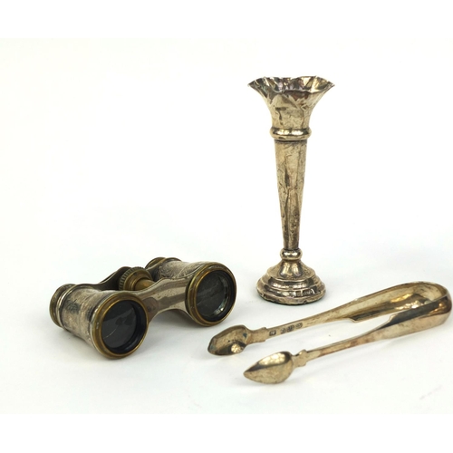 2436 - Silver items comprising a pair of Georgian sugar tongs, candle stick, bud vase and pair of silver mo... 