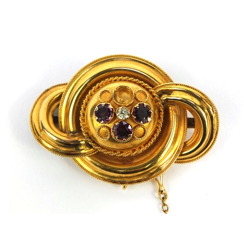 2515 - Victorian unmarked gold brooch set with amethyst stones and a central clear stone, 4.5cm long, appro... 