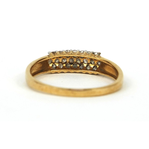 2580 - 9ct gold diamond three row ring, set with twenty two diamonds, size R, approximate weight 2.2g