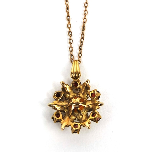 2575 - 9ct gold garnet and pearl pendant on a 9ct gold necklace, the pendant 2cm in diameter, approximate w... 