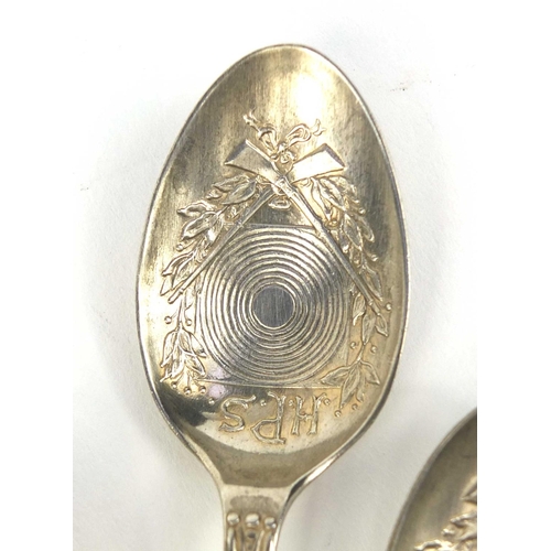 2434A - Set of seven Military interest rifle shooting club teaspoons, the bowls decorated with crossed rifle... 