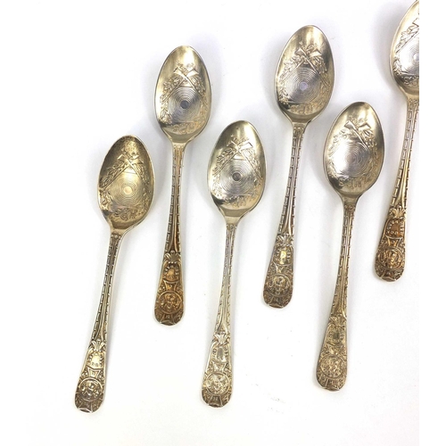 2434A - Set of seven Military interest rifle shooting club teaspoons, the bowls decorated with crossed rifle... 