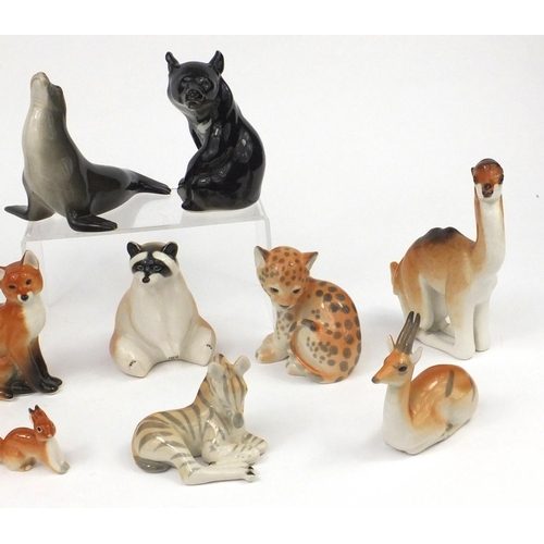 2261 - Group of Russian USSR porcelain animals including an eskimo with a husky, seal, baby zebra etc, the ... 