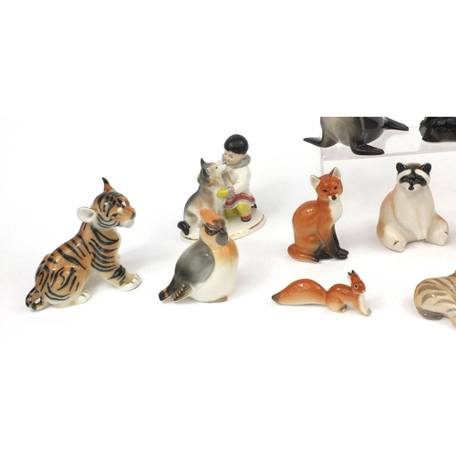 2261 - Group of Russian USSR porcelain animals including an eskimo with a husky, seal, baby zebra etc, the ... 