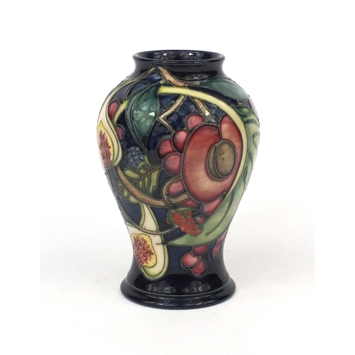 2235 - Moorcroft pottery baluster vase hand painted and tube lined with stylised fruit, factory marks, init... 