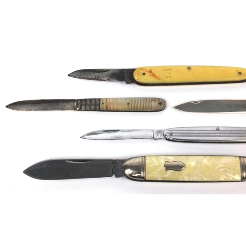 2385 - Five pocket knives including a Georgian silver laded Mother of pearl flanked example, the largest 9c... 