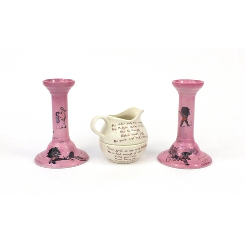 2144 - Pair of T & R Boote porcelain Golly Wogs candle stick and a jug/sugar bowl, the candle sticks each 1... 