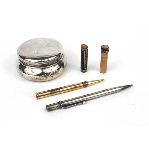 2392A - Two propelling pencils, together with a silver box and cover, comprising a silver example with engin... 