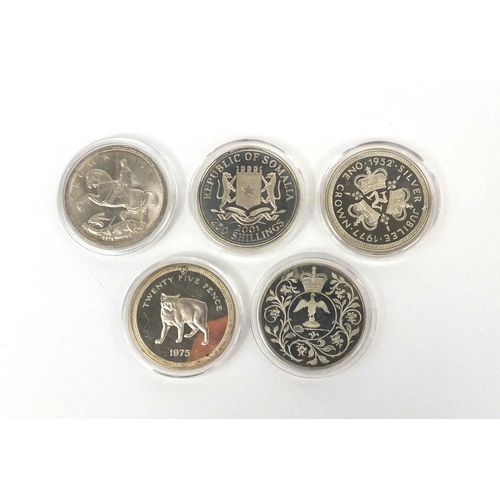 2746 - George V 1935 rocking horse crown, together with four coins including silver proof Gothic crown repl... 