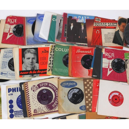 2304 - Group of 45rpm rock and roll vinyl records including Eddie Cochran and Billy Fury examples