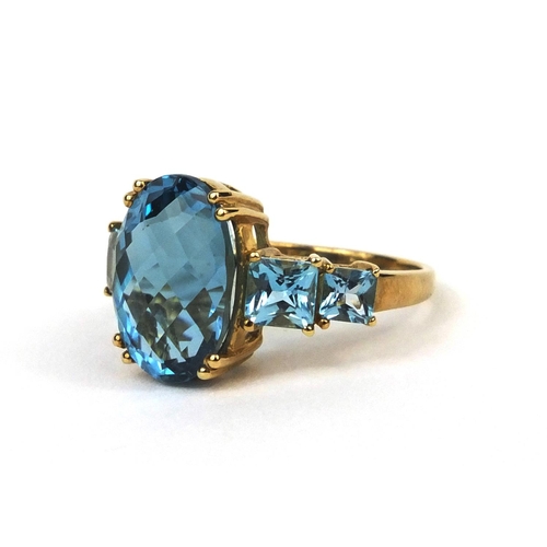 2584 - 9ct gold blue topaz dress ring, size M, approximate weight 4.7g