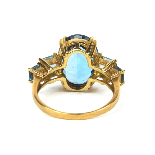 2584 - 9ct gold blue topaz dress ring, size M, approximate weight 4.7g