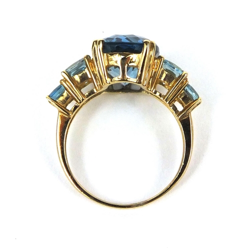 2584 - 9ct gold blue topaz dress ring, size M, approximate weight 4.7g