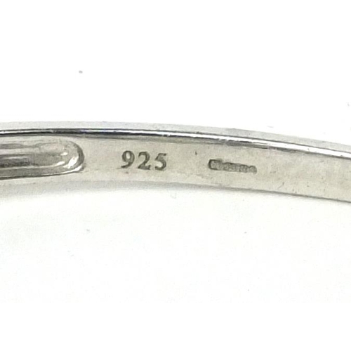 2557 - Stylish silver bangle set with blue and white diamonds, 6.5cm long, approximate weight 10.4g