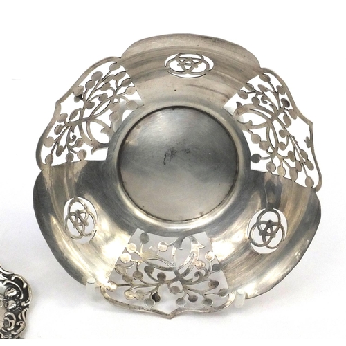 2438 - Silver items comprising two napkin rings, circular dish with pierced decoration and two spoons toget... 