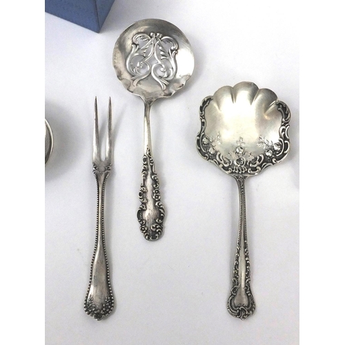 2438 - Silver items comprising two napkin rings, circular dish with pierced decoration and two spoons toget... 