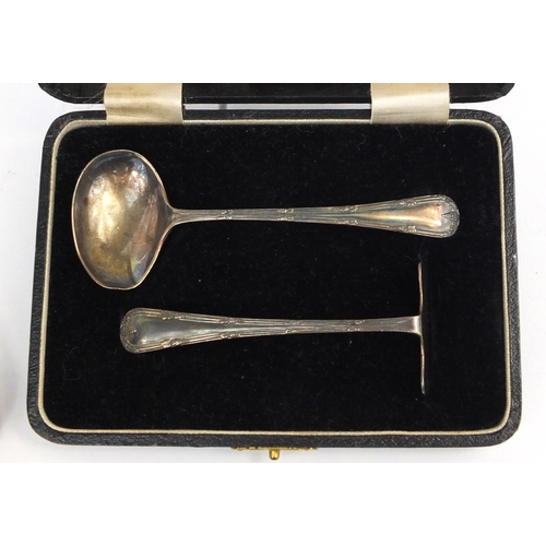 2472 - Four cased sets of silver items comprising knife, fork and spoon, babies food spoon and pusher, silv... 