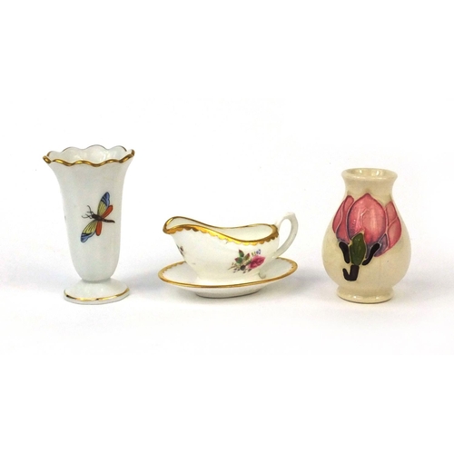 2211 - Two miniature vases and a miniature Coalport gravy boat, the vases comprising Moorcroft and Herend o... 