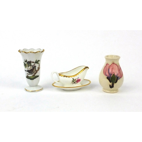 2211 - Two miniature vases and a miniature Coalport gravy boat, the vases comprising Moorcroft and Herend o... 