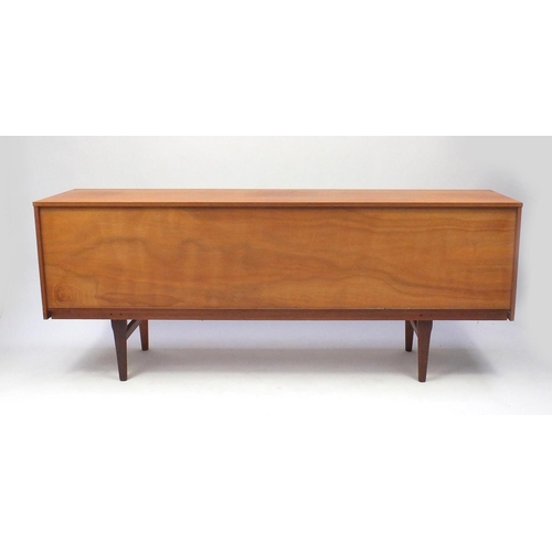 2022 - 1970s teak sideboard fitted with three drawers and a pair of cupboard doors, 72cm high x 181cm wide ... 