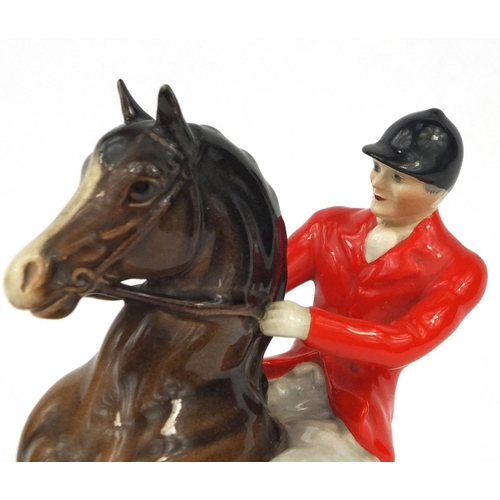 2112 - Beswick huntsman on a rearing horse, factory marks and numbered 868 to the base, 25cm high