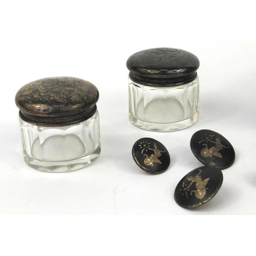 2454 - Four Siam silver buttons, silver plated wooden and bevelled glass WMF box and two silver topped glas... 