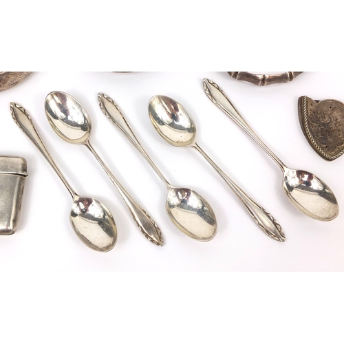 2418 - Silver items including three bangles, vesta, letter opener and teaspoons, approximate weight 187.0g