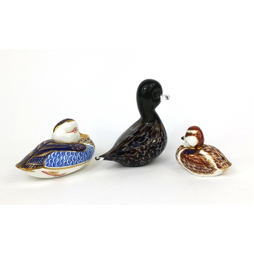 2183 - Two Royal Crown Derby duck paperweights, together with a Langham glass duck paperweight, the Royal C... 