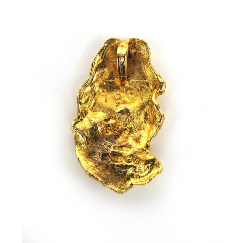 2494 - 9ct gold nugget pendant set with a solitaire diamond, 4cm long, approximate weight  15.0g