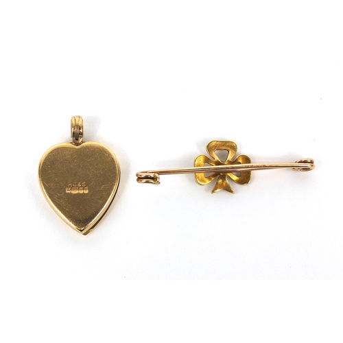 2511 - 9ct gold love heart locket and a 9ct gold seed pearl clover brooch, approximate weight  7.0g