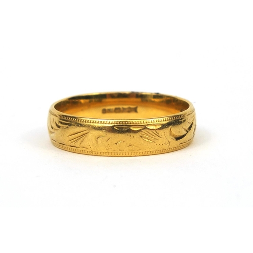 2544 - 18ct gold wedding band with floral chased decoration, size W, approximate weight  6.9g