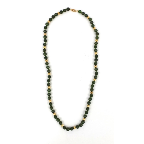 2550 - Green jadeite and 14ct gold necklace, 66cm long, approximate weight  51.2g