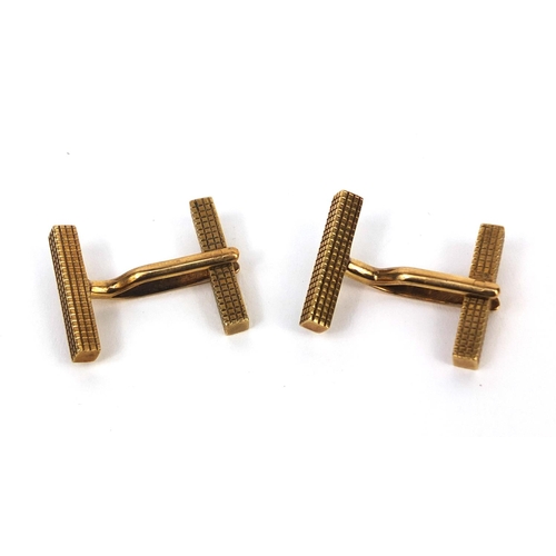 2510 - Pair of 9ct gold cufflinks with engine turned decoration, 2.5cm long, approximate weight 6.6g