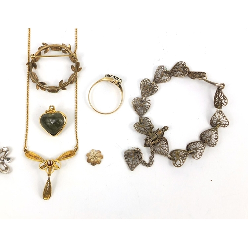 2643 - Assorted jewellery including a 9ct gold diamond crossover ring, silver necklaces, a wreath brooch et... 