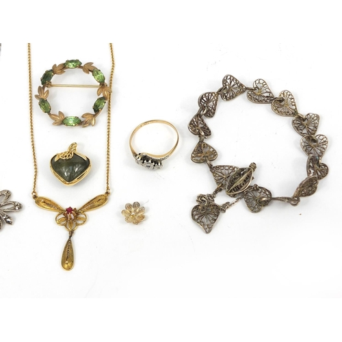 2643 - Assorted jewellery including a 9ct gold diamond crossover ring, silver necklaces, a wreath brooch et... 