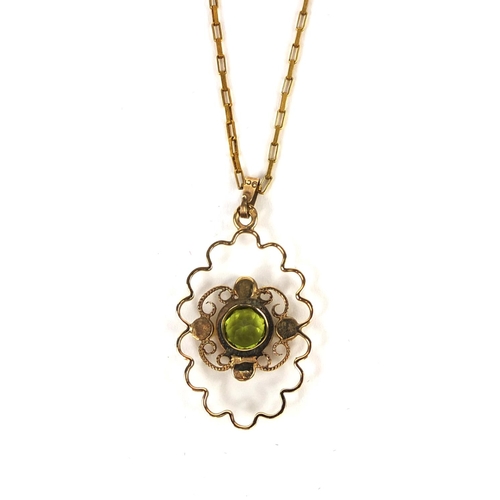 2646 - 9ct gold green stone and seed pearl pendant on a 9ct gold necklace, the pendant 3.2cm long, approxim... 