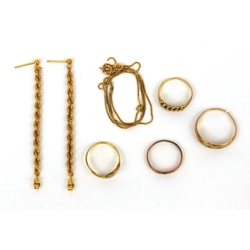 2546 - Broken 9ct gold jewellery comprising a necklace and three rings, together with a pair of gold colour... 