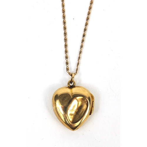 2542 - 9ct gold love heart locket, 2.2cm long on a gold coloured metal necklace, approximate weight  5.5g