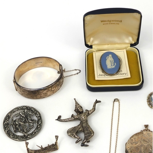 2641 - Assorted costume jewellery including a large circular silver locket with floral chased decoration, s... 