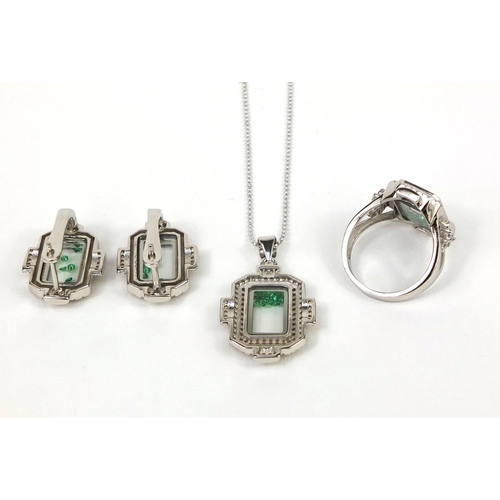 2596 - Silver cubic zirconia jewellery suite, each set with floating green glass stones, the ring size N, a... 