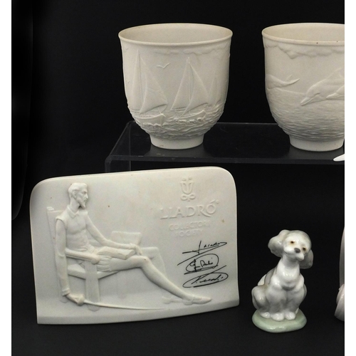 2134 - Group of Lladro including Lladro Society scroll and a pair of cups decorated with dolphins, the larg... 