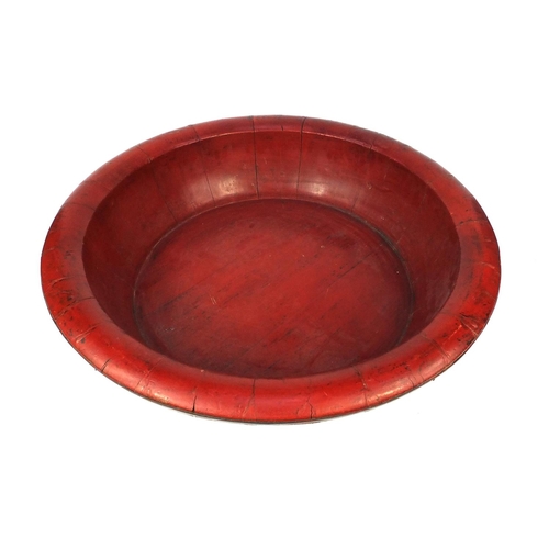 2068 - Large red lacquered metal bound bowl, 70cm diameter