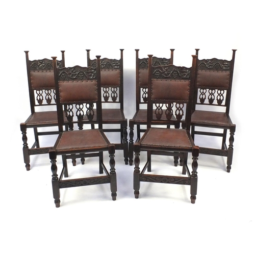 2063 - Set of six oak dining chairs  carved with fruit and vine decoration , each 107cm high