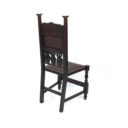 2063 - Set of six oak dining chairs  carved with fruit and vine decoration , each 107cm high