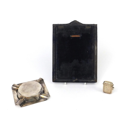 2422 - Silver items comprising rectangular embossed easel photo frame, square ashtray with engine turned de... 