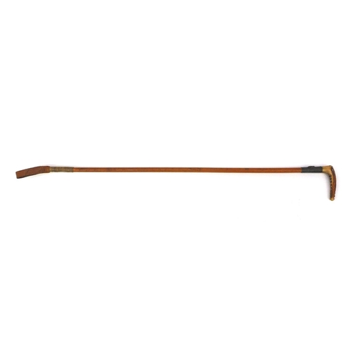 2402A - Swaine & Co of London Malacca riding crop with unmarked silver mounted decorated in relief with a fo... 