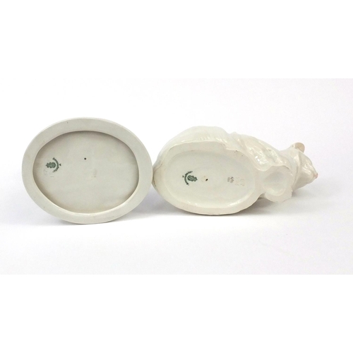 2180 - Two Nymphenburg porcelain cats including one seated, each with factory marks to the bases, one numbe... 