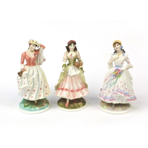 2156 - Three Royal Worcester figurines comprising The Village Bride 339/9500, The Queen of the May 971/9500... 