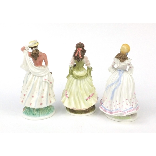 2156 - Three Royal Worcester figurines comprising The Village Bride 339/9500, The Queen of the May 971/9500... 