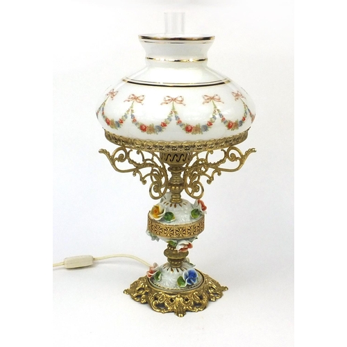 2217 - Floral encrusted porcelain and gilt lamp with glass shade, 53cm high